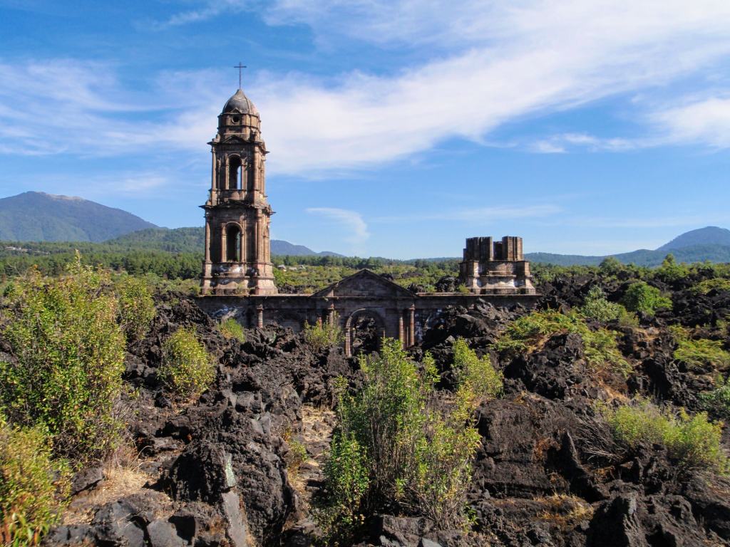 Remains of the San Juan Parangaricutiro Church, surrounded by the volcanic rock from Parícutin.